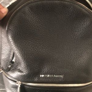 Used Micheal Kors back pack purse with bag
